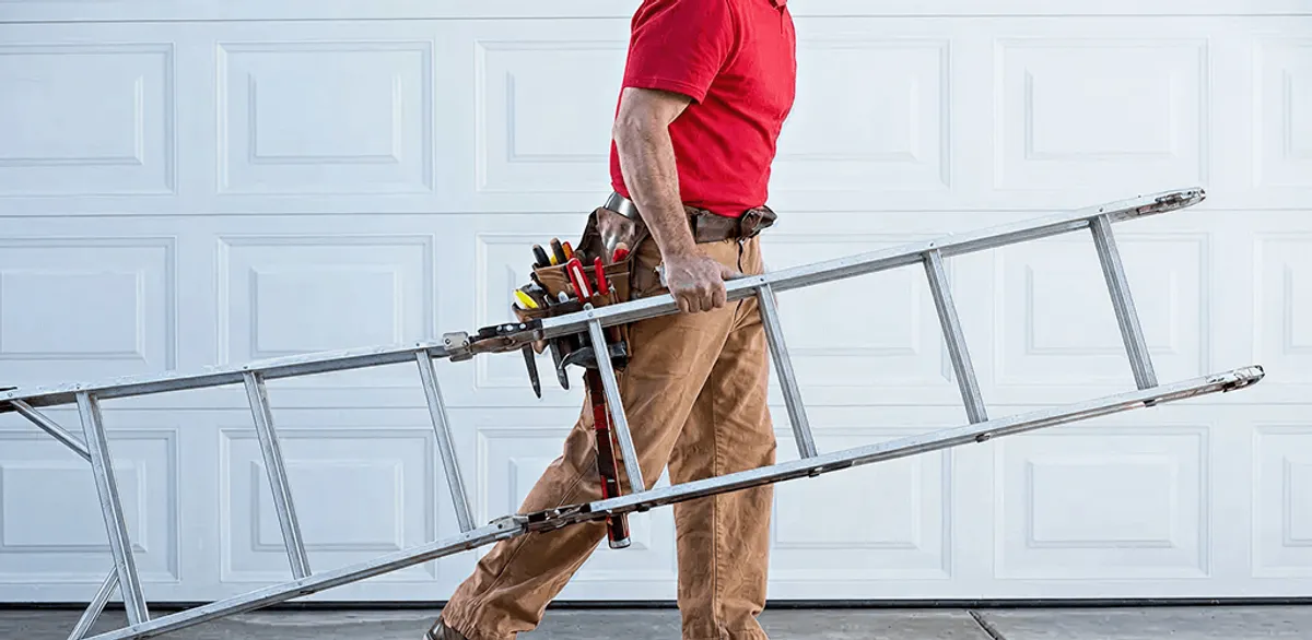 Garage door repair technician arriving with tools and ladder in Staten Island, NY