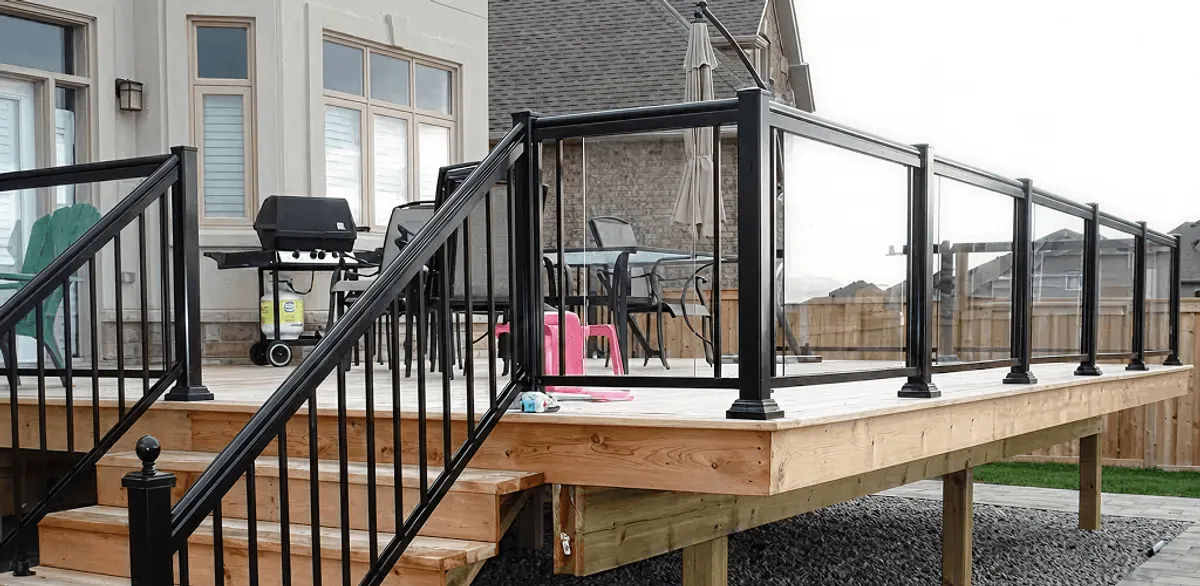 Handrail installation on a deck staircase for safety and code compliance in Staten Island, NY